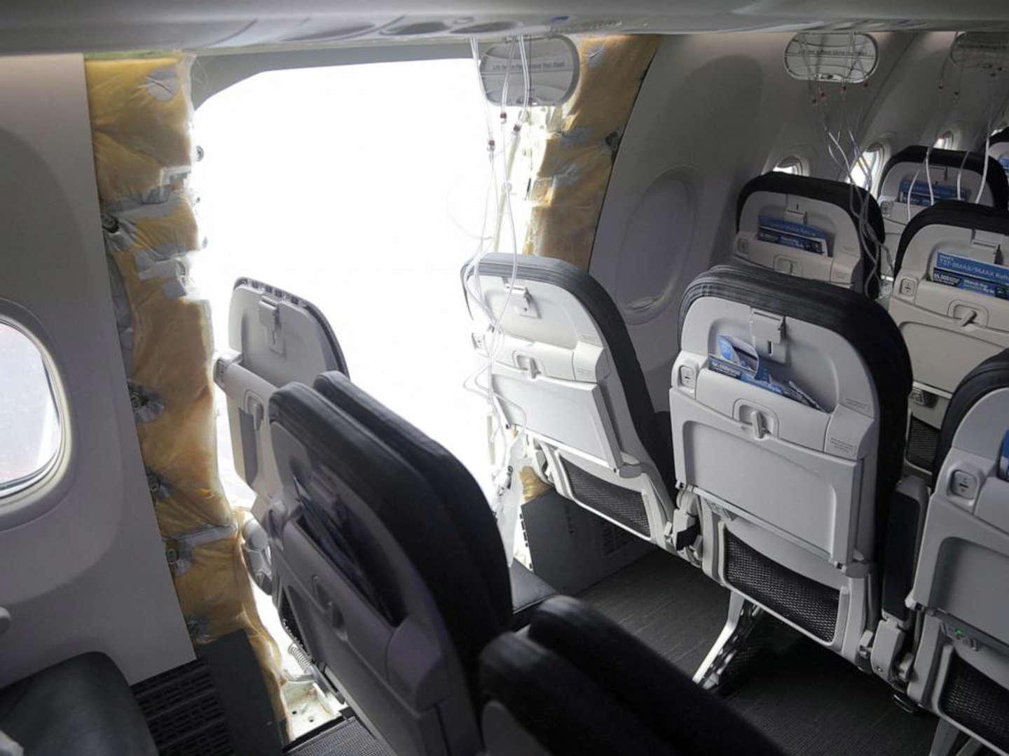 The fuselage plug area of Alaska Airlines Flight 1282 Boeing 737-9 Max, which was forced to make an emergency landing, is seen during its investigation by the National Transportation Safety Board in Portland, Ore, Jan. 7, 2024. © NTSB/Handout via Reuters, FILE